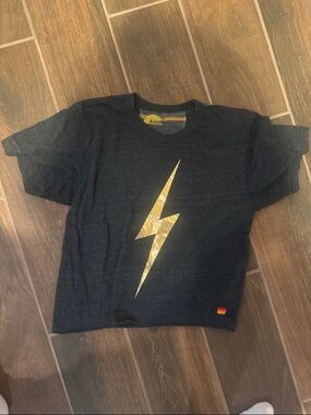 Aviator Nation dark gray Tee with Gold Lightning Bolt Graphic